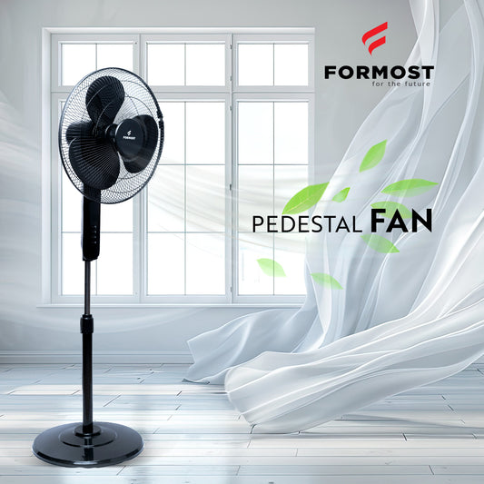 Black pedestal fan in a room with white curtains and a window, featuring the Formost brand.