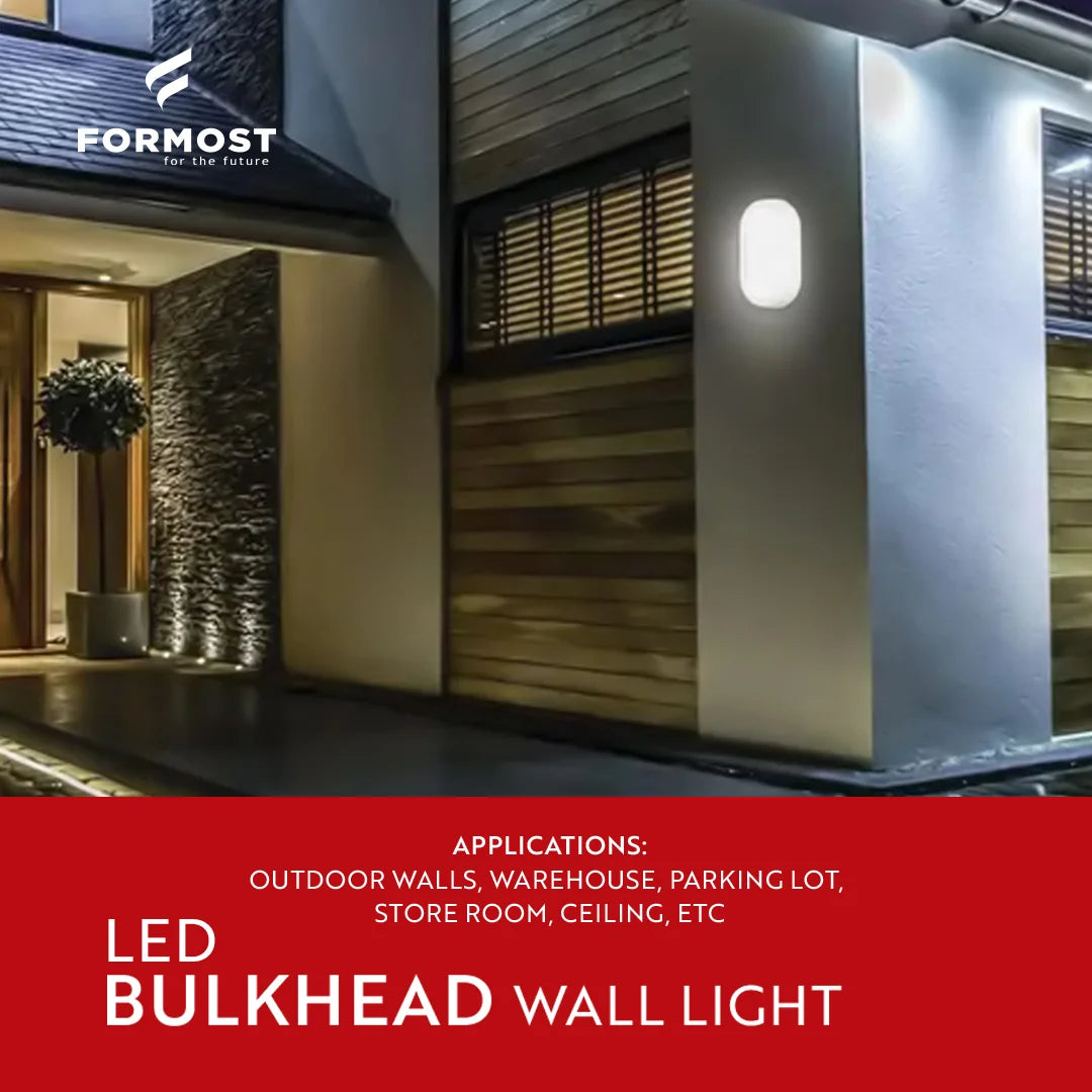 LED bulkhead wall light fixture on a building exterior with Formost branding.